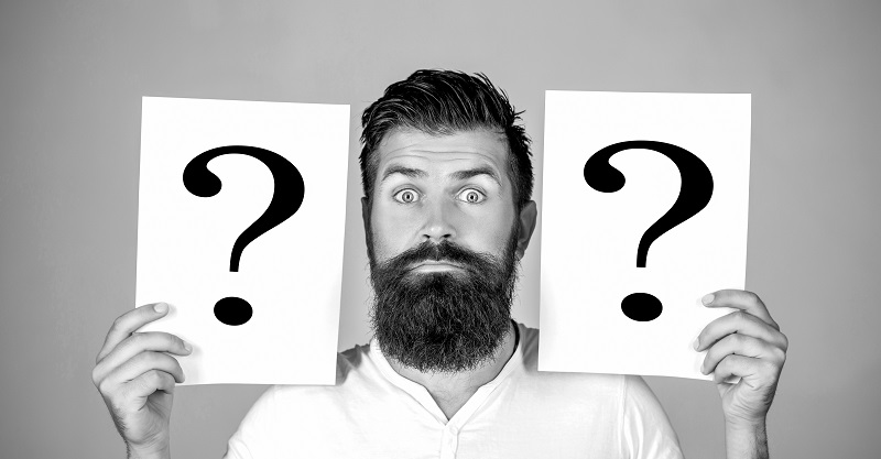 Man with question mark. Paper notes with question marks. Beard man question mark, solution problems. Thinking man with question mark